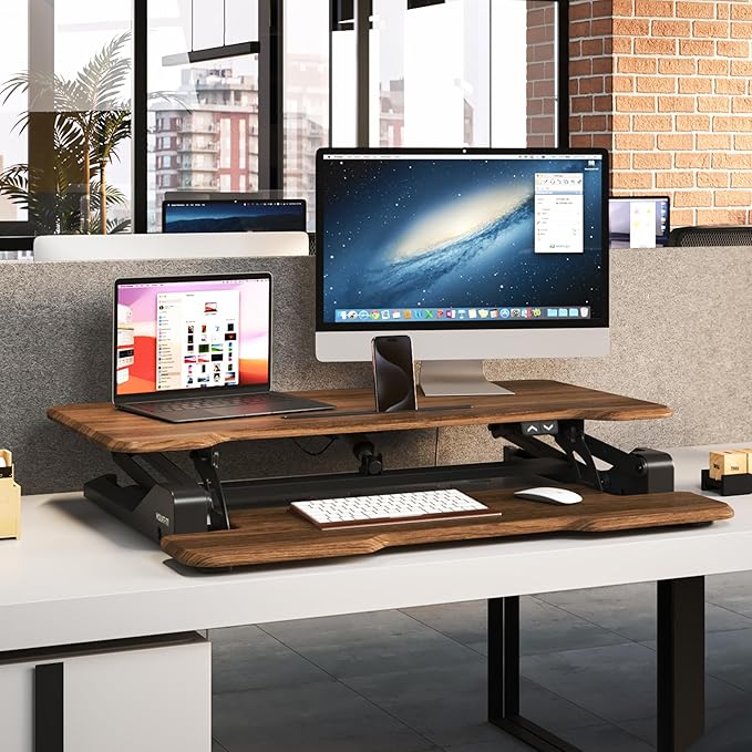 Mount-It! Electric Standing Desk Converter with 38" Tabletop, Height Adjustable Desk Riser, Motorized Desk Riser with Keyboard Tray and Device Slot, Fits Monitor & Laptop, Dark Walnut